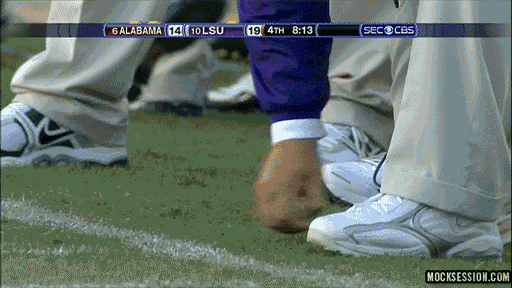 lsu-les-miles-eating-grass.gif