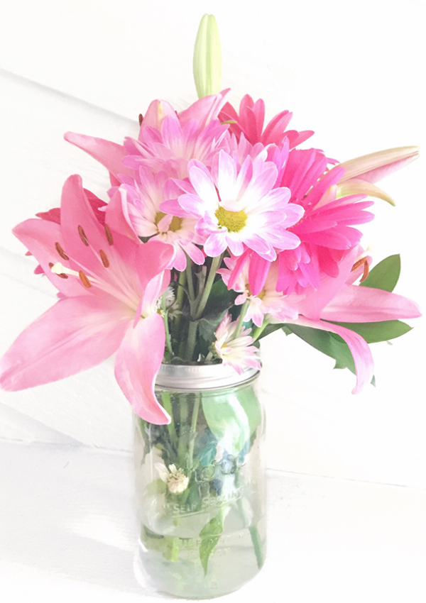 Pink flowers in mason jar