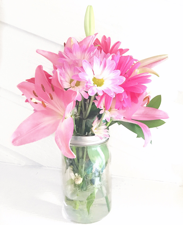 Pink flowers in mason jar