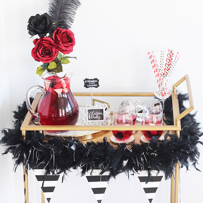 50 Shades Freed Party & Bar Cart Inspiration. How to throw a 50 Shades of Grey themed party with a styled bar cart and forbidden fruit sangria cocktail drink recipe.