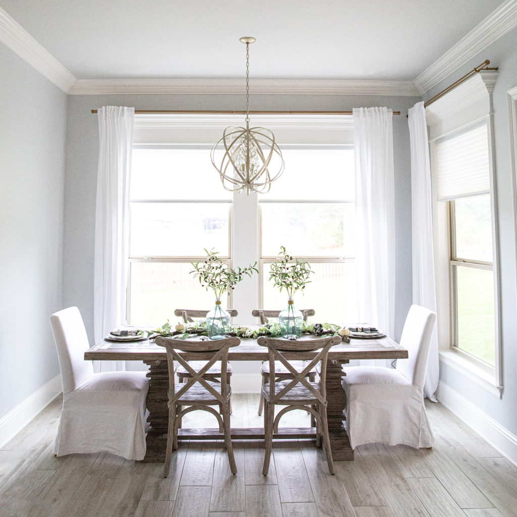 Bright dining room with slipcovered chairs 