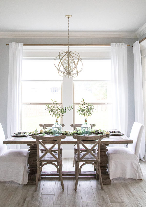 Bright dining room with slipcovered chairs