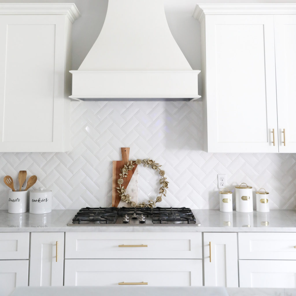 White Marble Kitchen with Gold Hardware